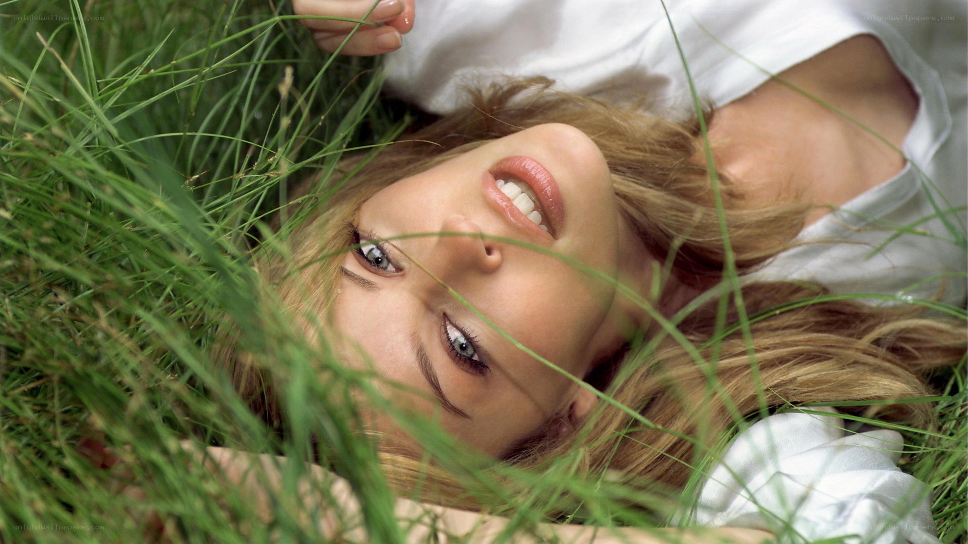 woman lying in grass