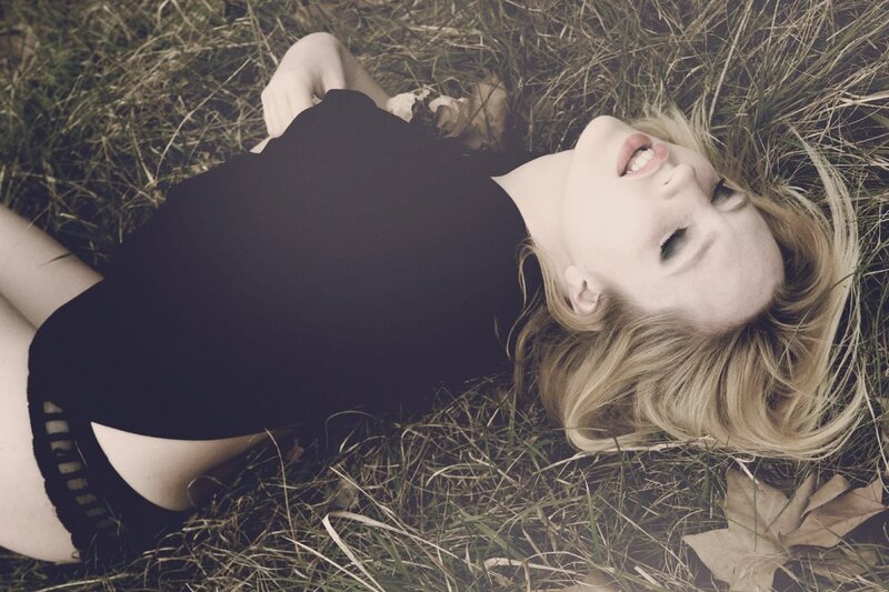 woman lying in grass