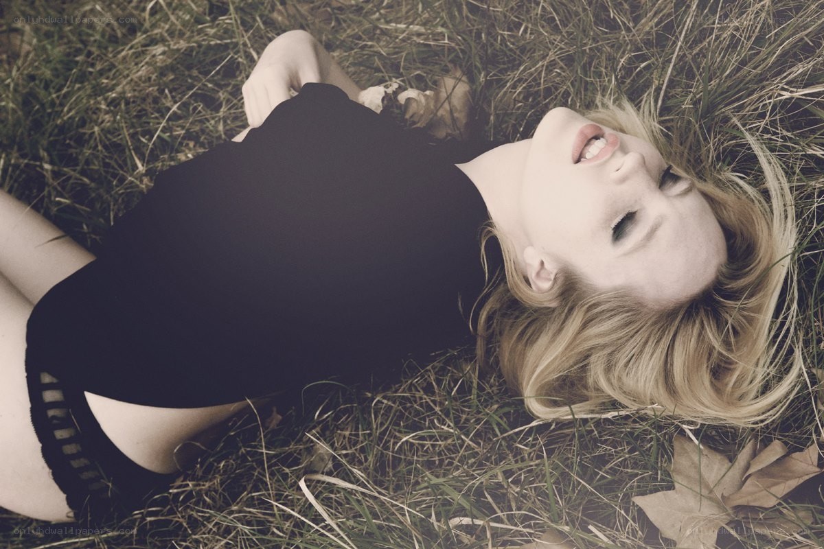 woman lying in grass