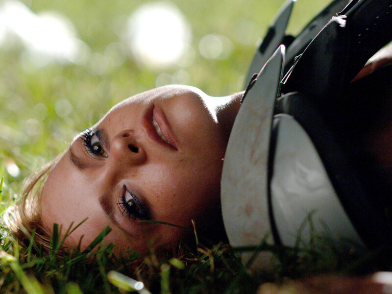 woman lying in grass