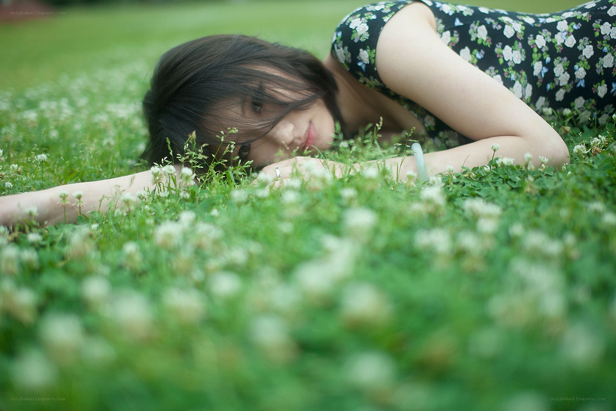 woman lying in grass