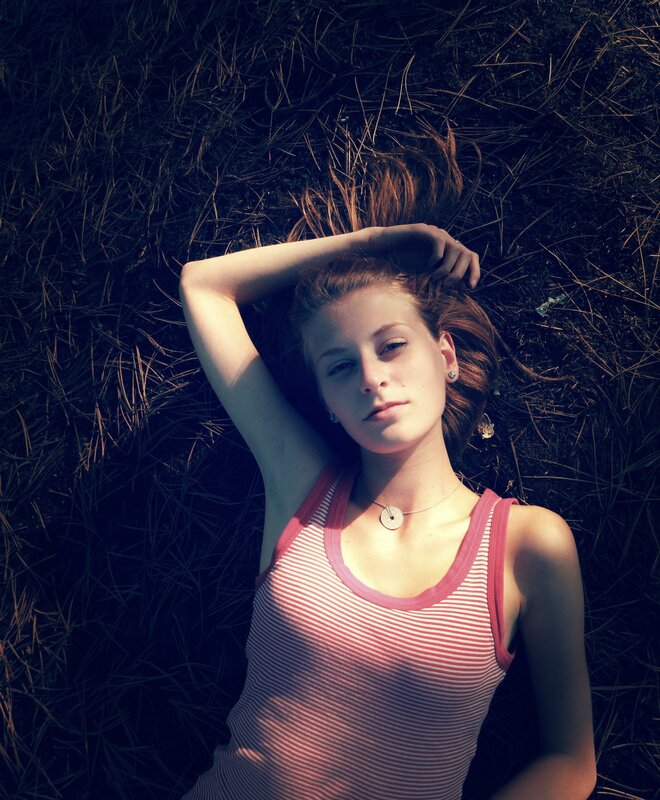 woman lying in grass
