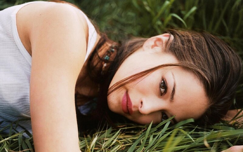 woman lying in grass