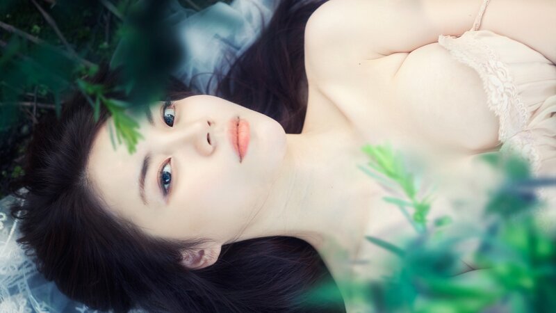 woman lying in grass
