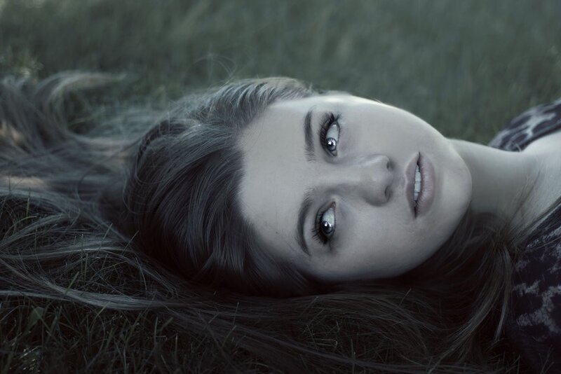 woman lying in grass
