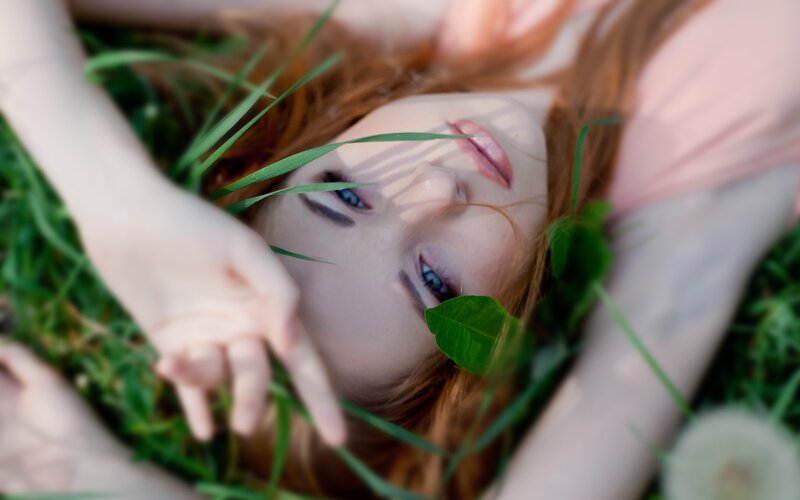 woman lying in grass
