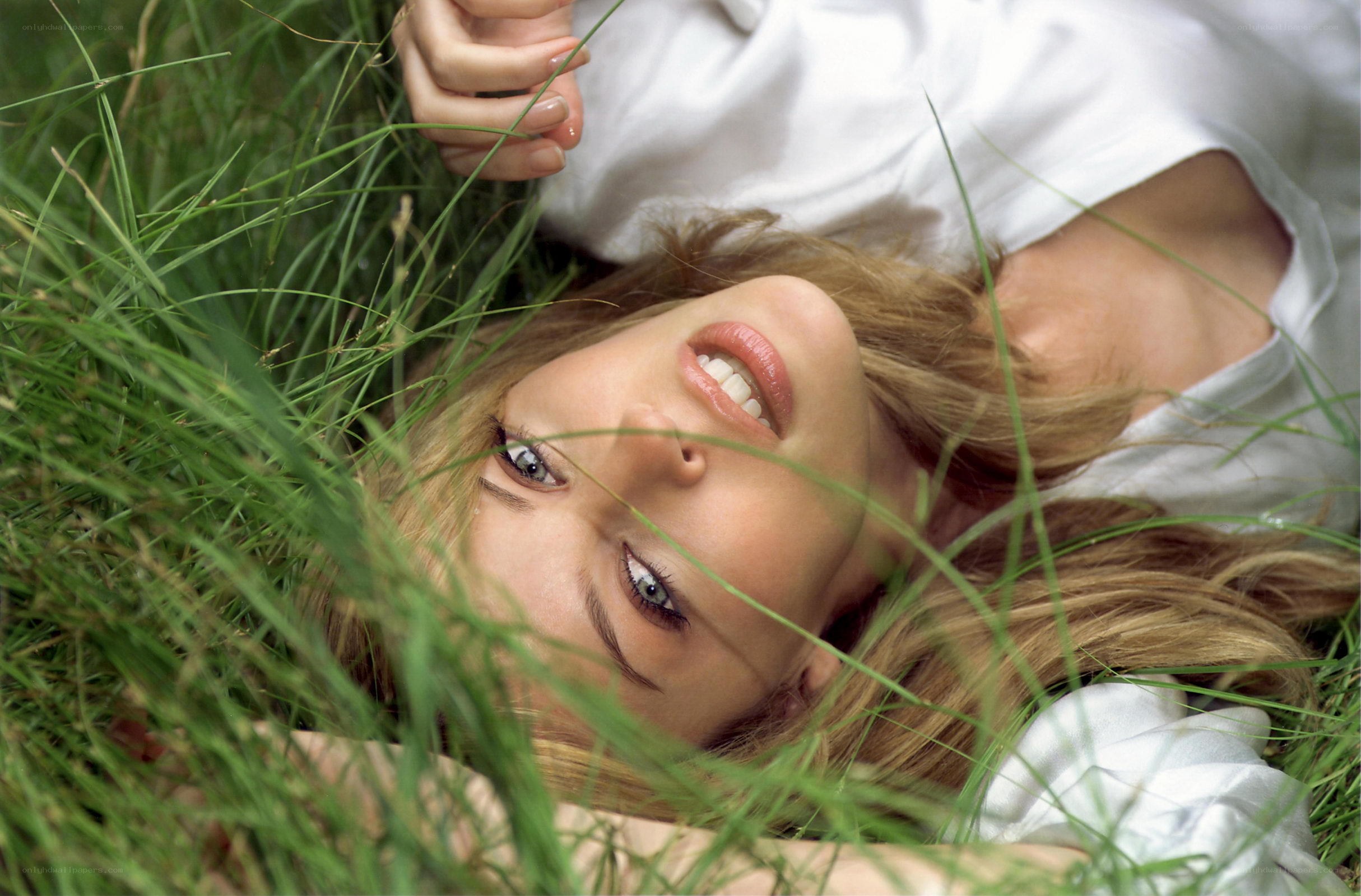 woman lying in grass