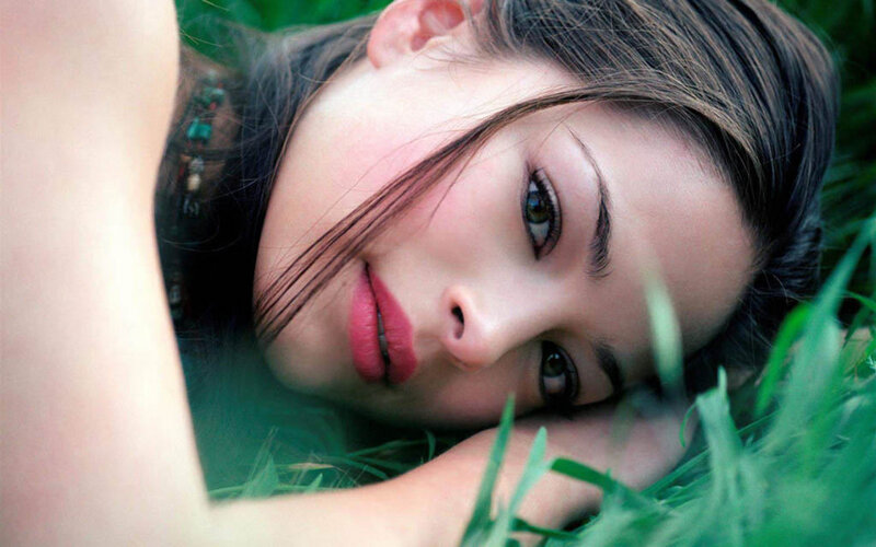woman lying in grass