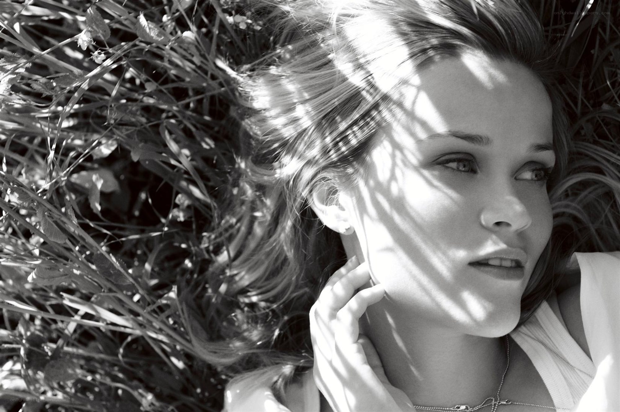 woman lying in grass