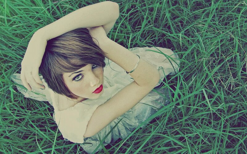 woman lying in grass