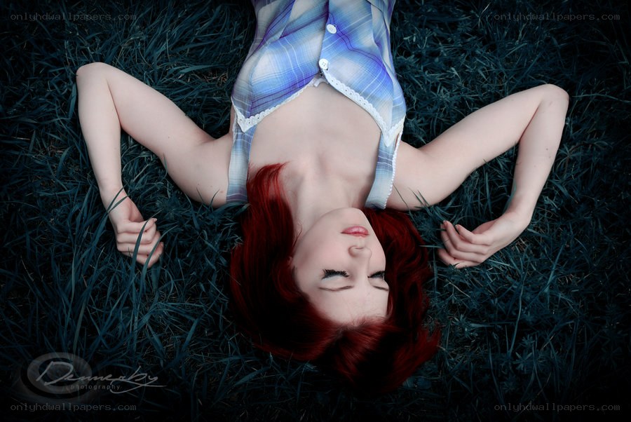 woman lying in grass