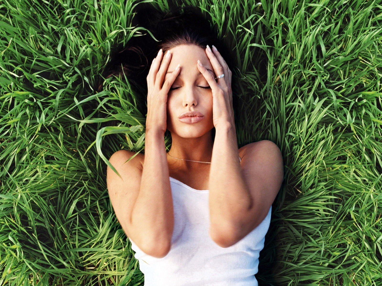 woman lying in grass