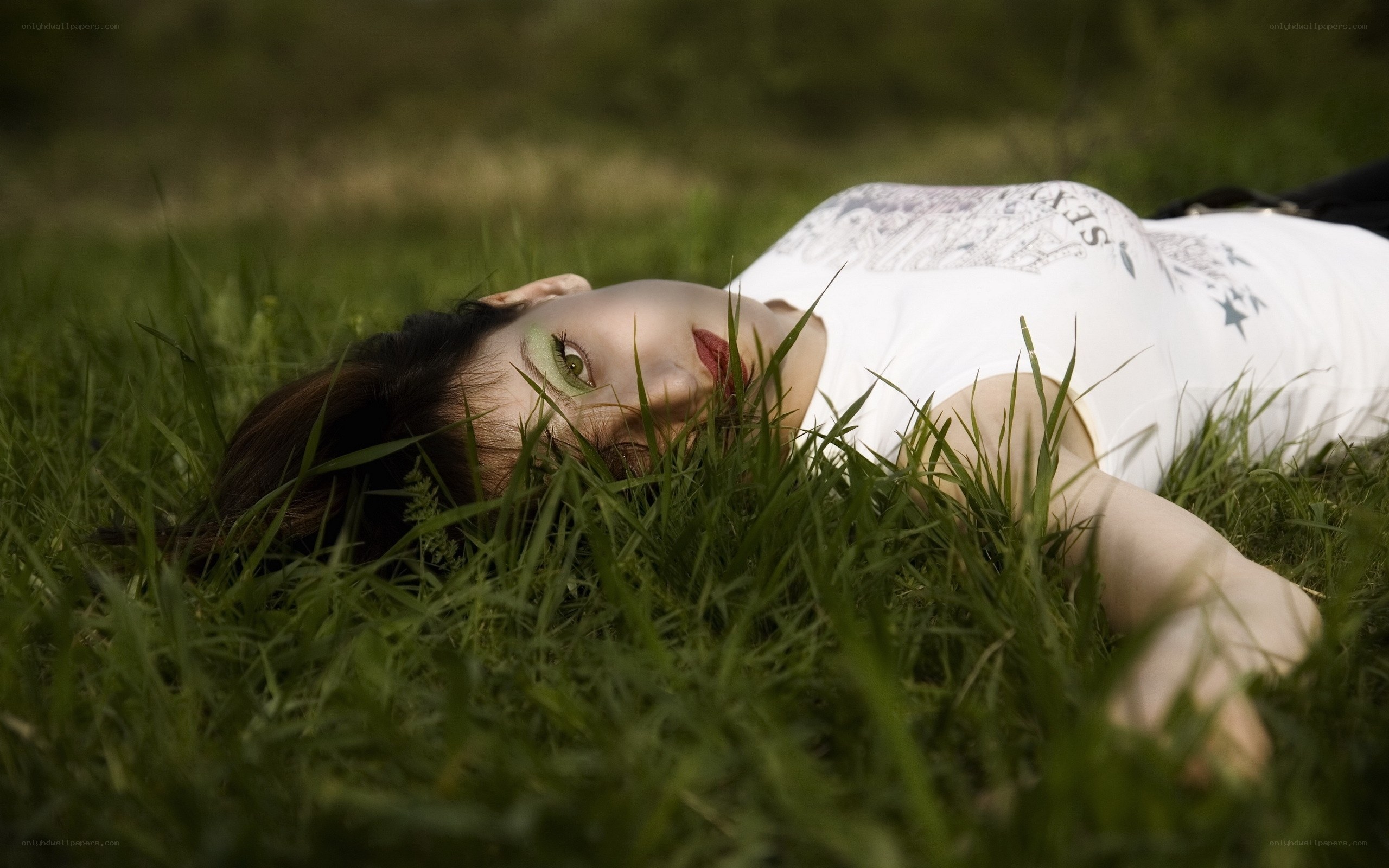 woman lying in grass