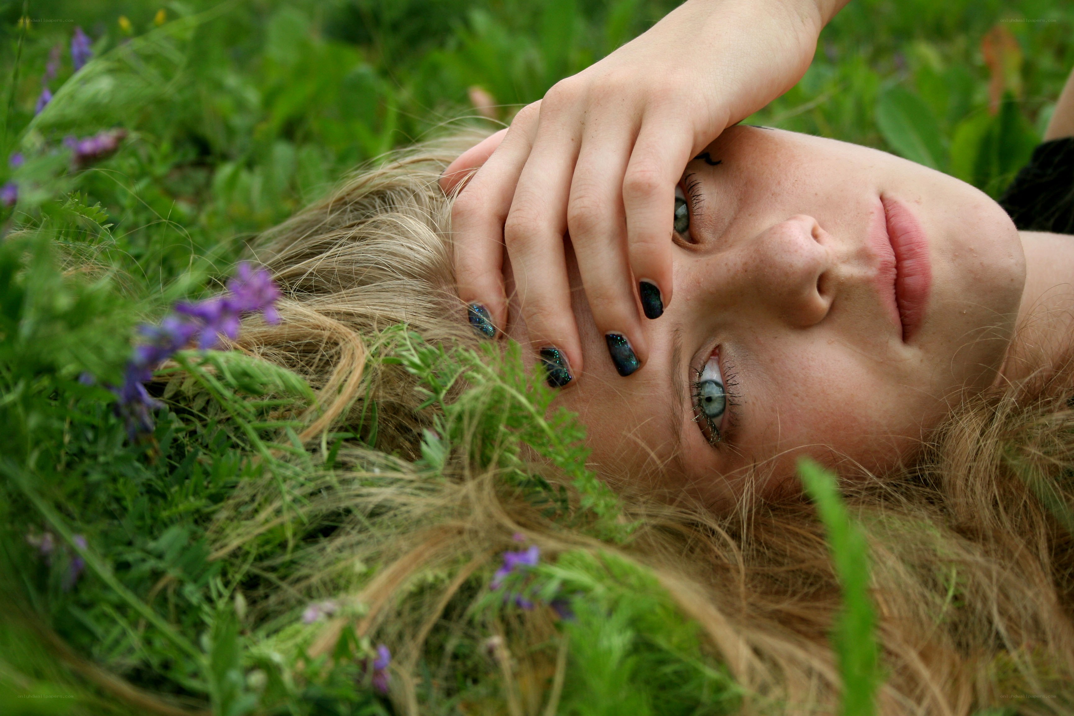 woman lying in grass