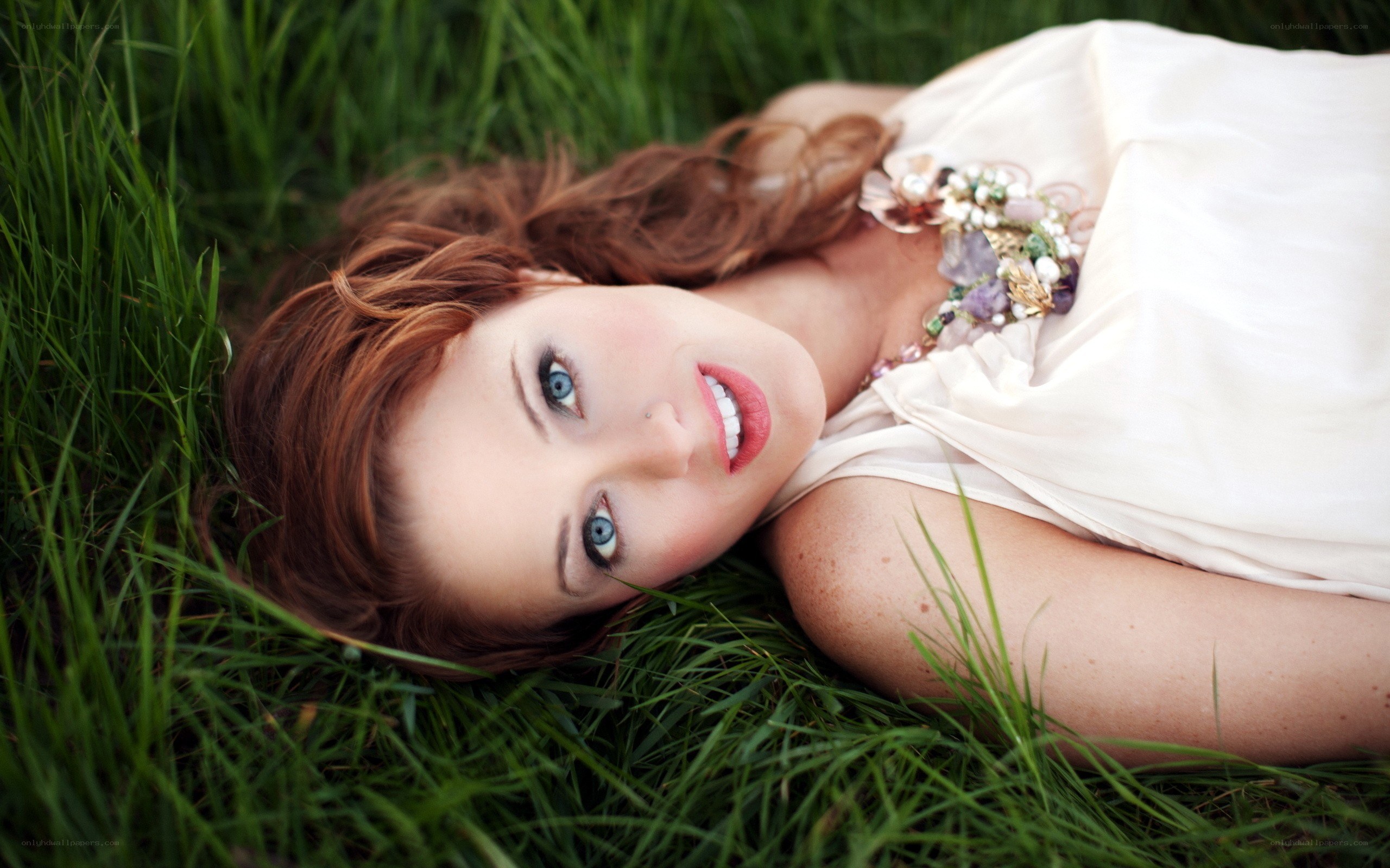 woman lying in grass