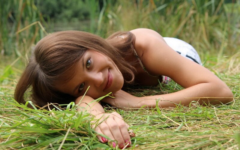 woman lying in grass