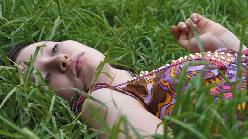 woman lying in grass