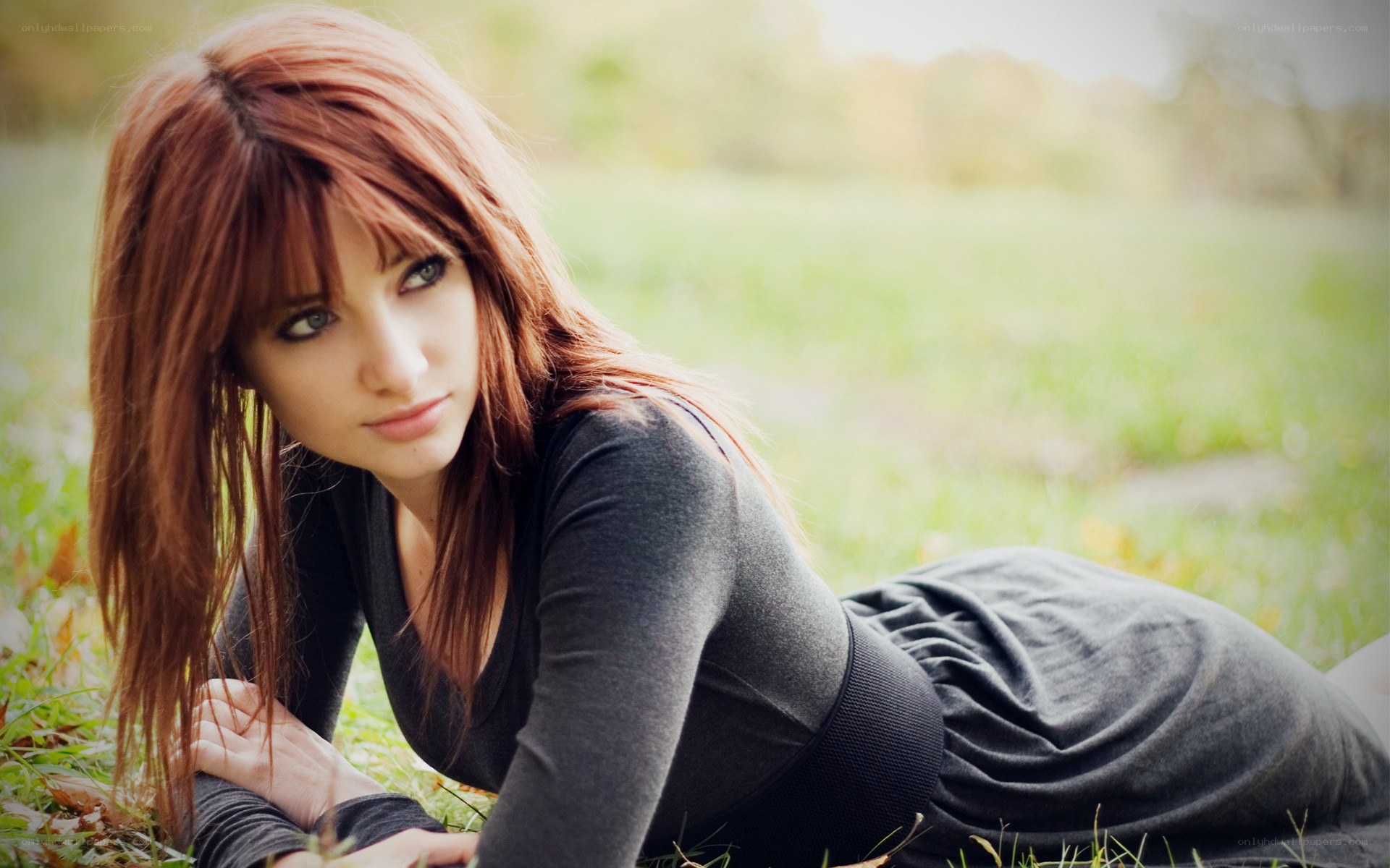 woman lying in grass