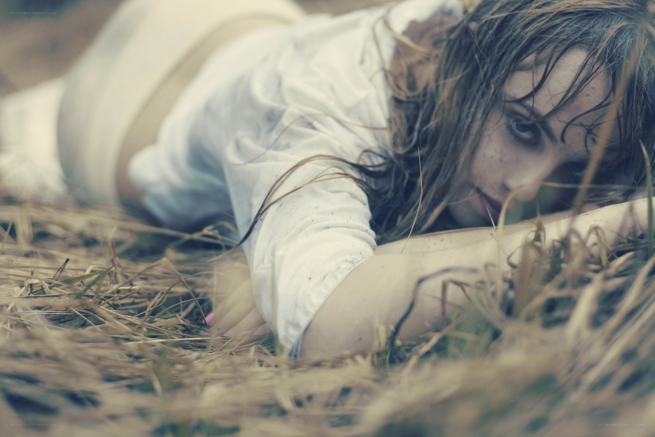 woman lying in grass