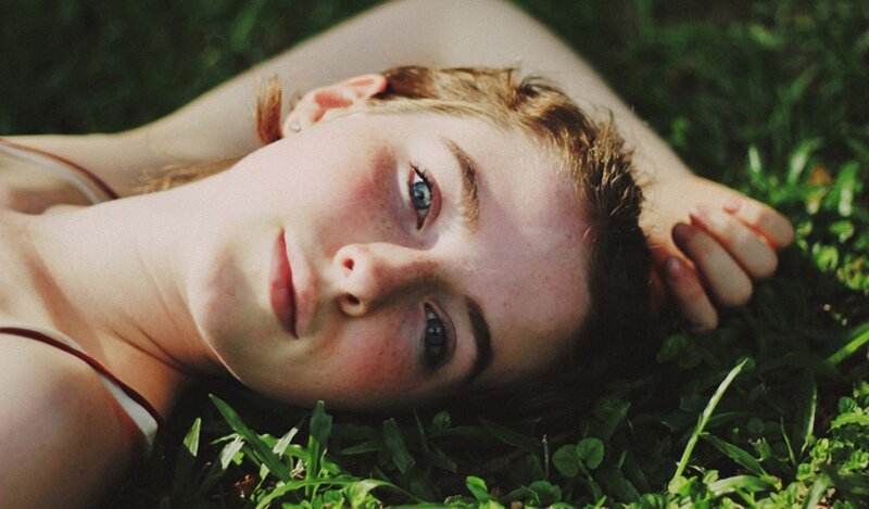 woman lying in grass