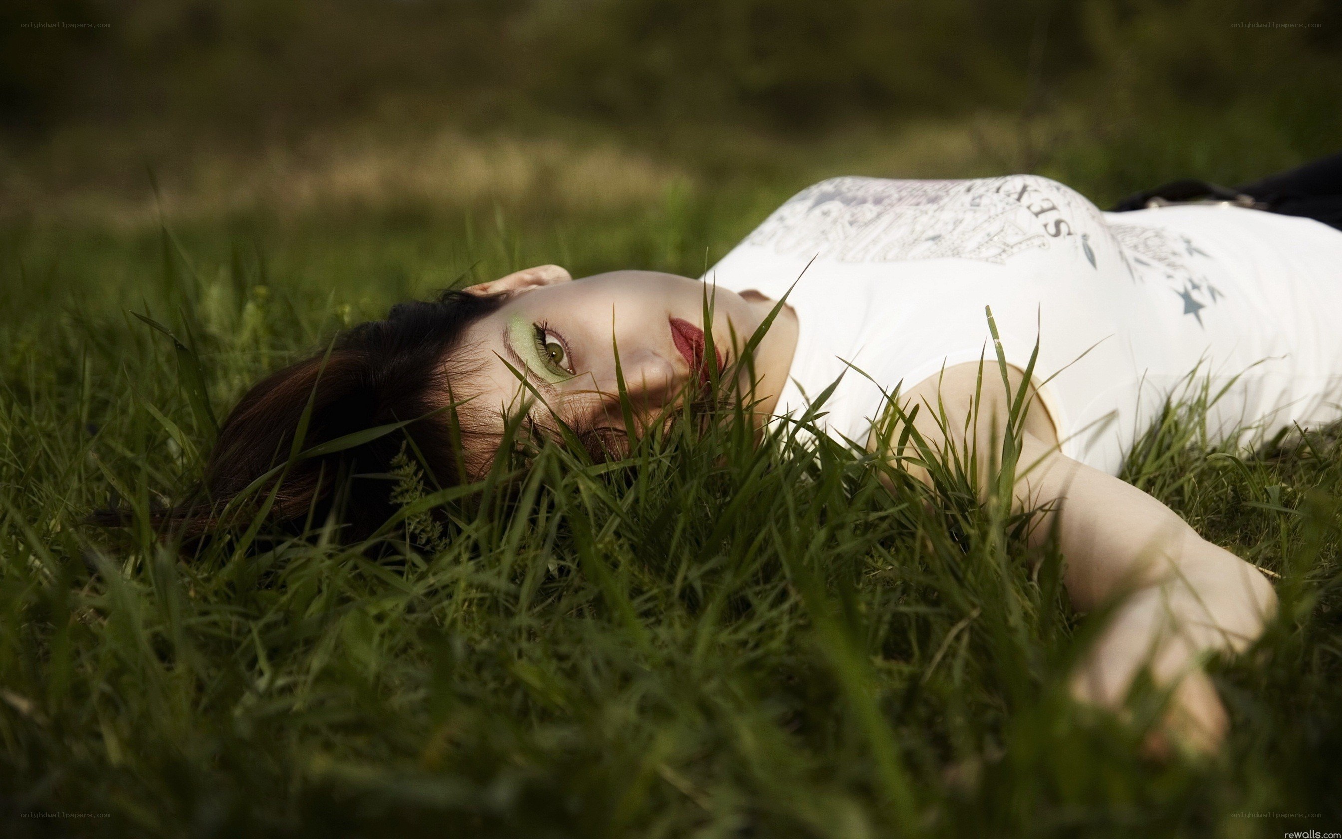 Woman lying in grass