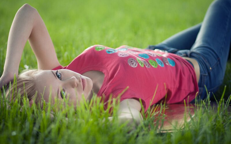 woman lying in grass