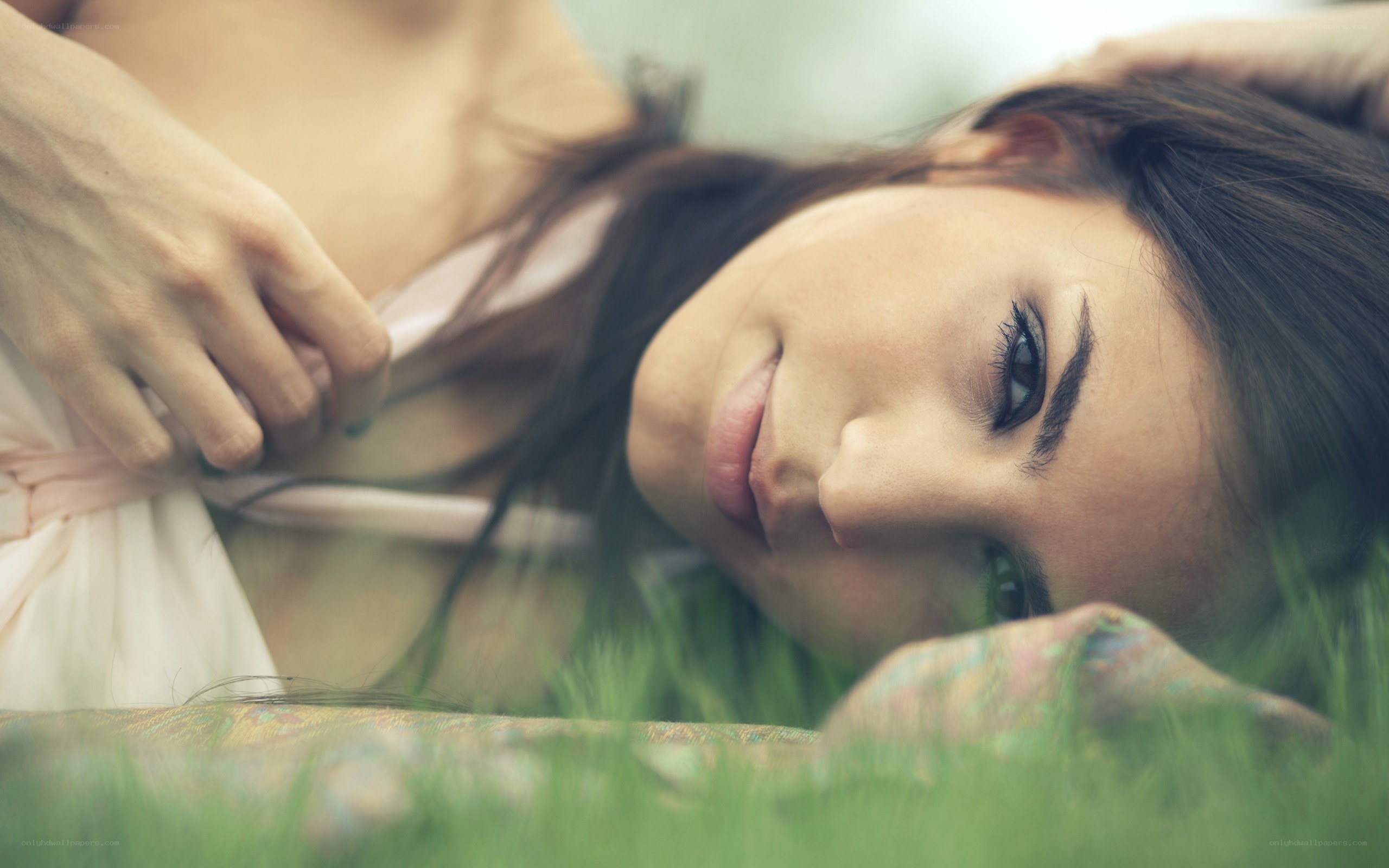 woman lying in grass