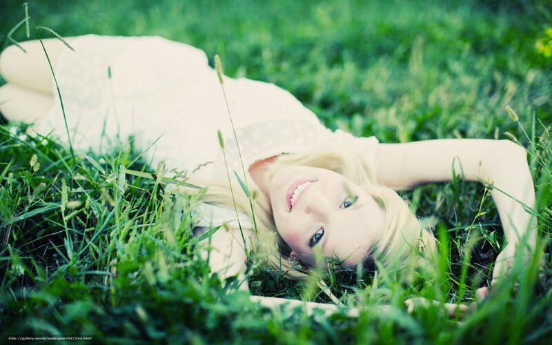 woman lying in grass