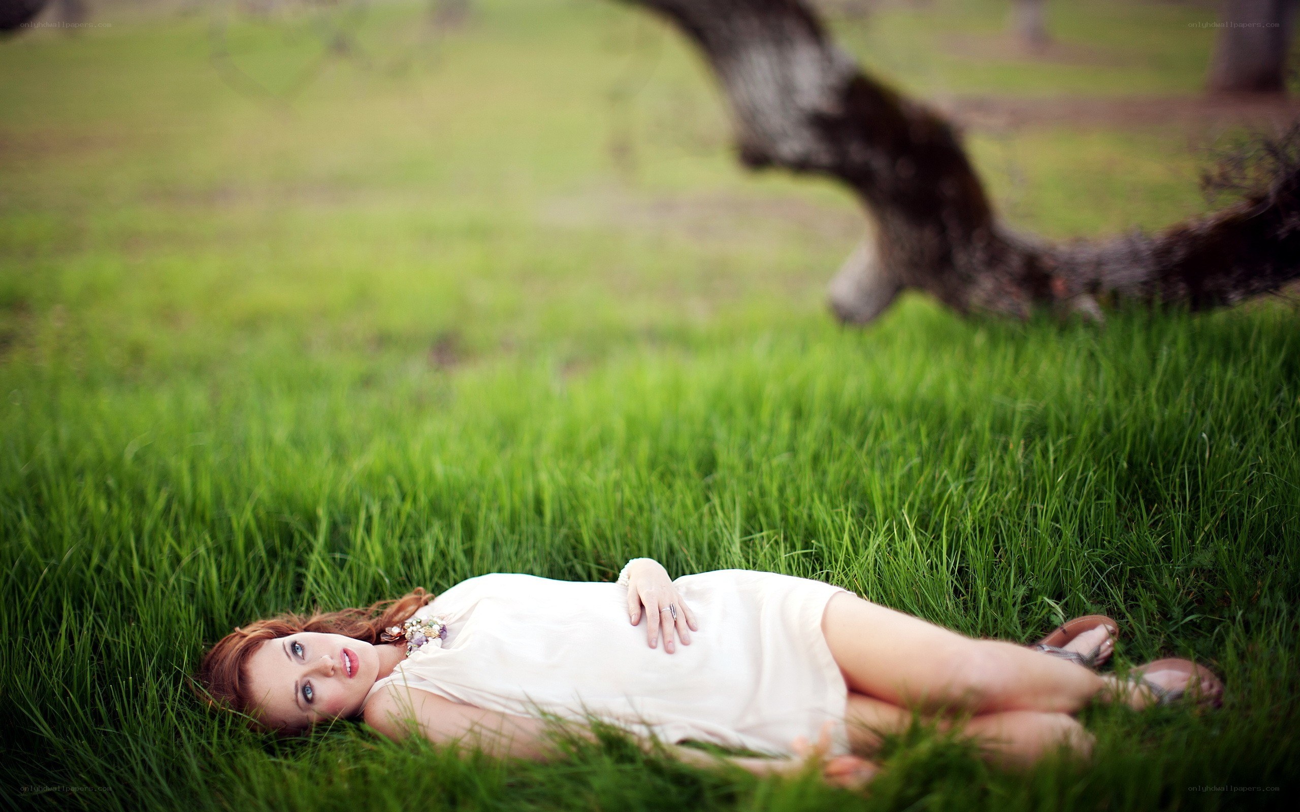Woman lying in grass