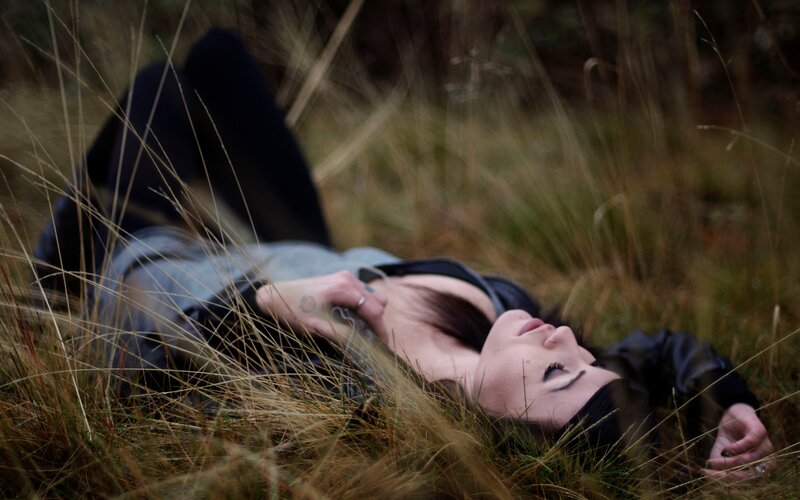 woman lying in grass