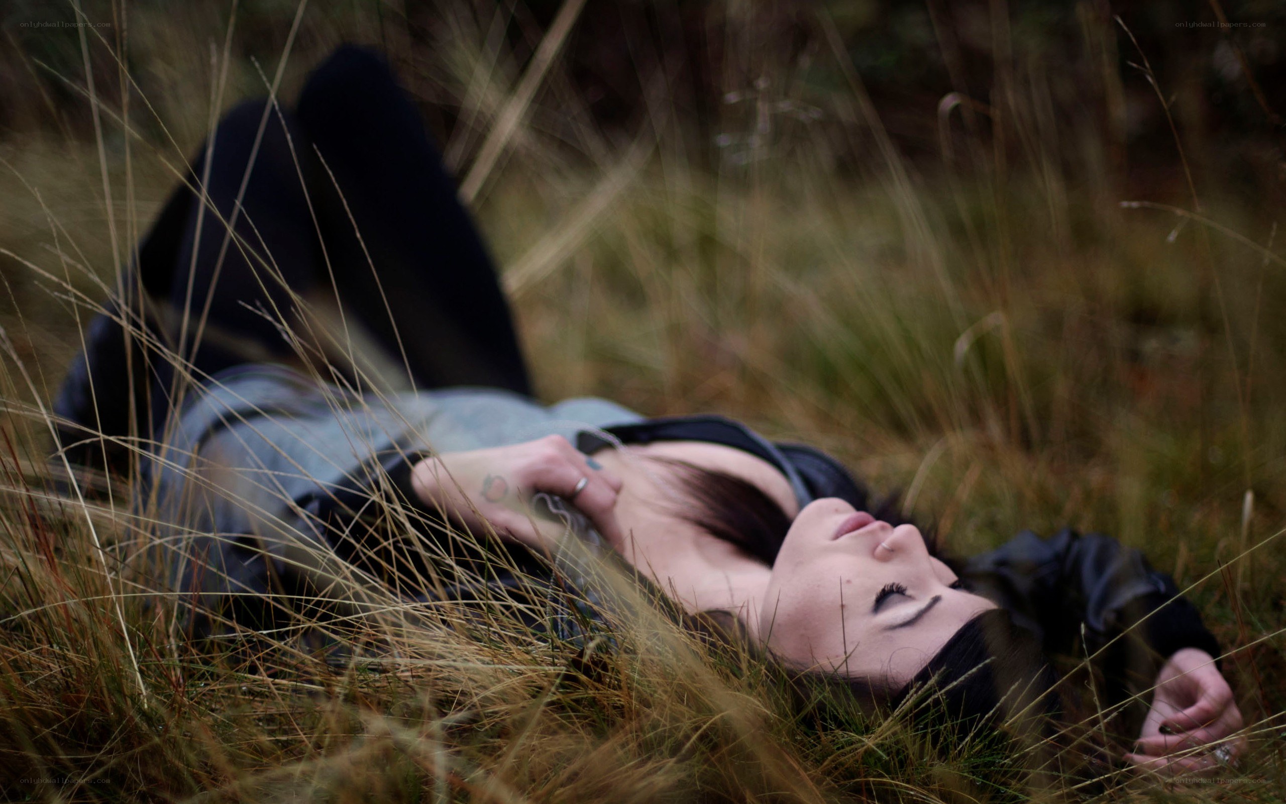 woman lying in grass