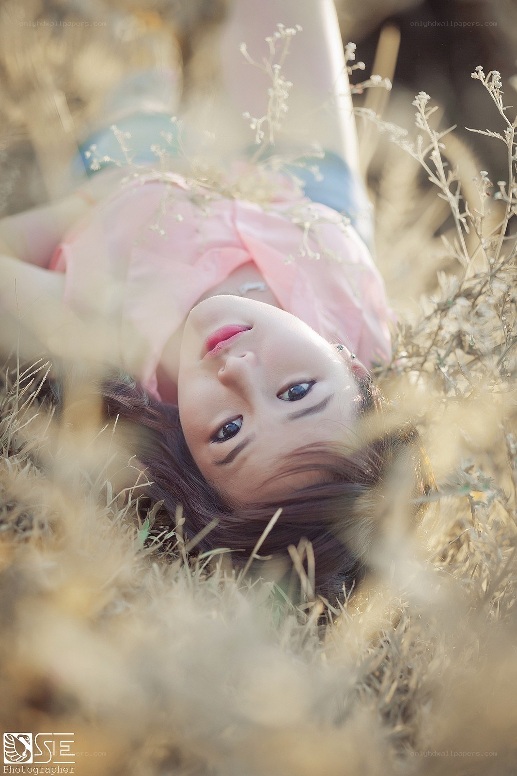 woman lying in grass