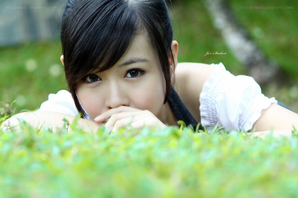 woman lying in grass