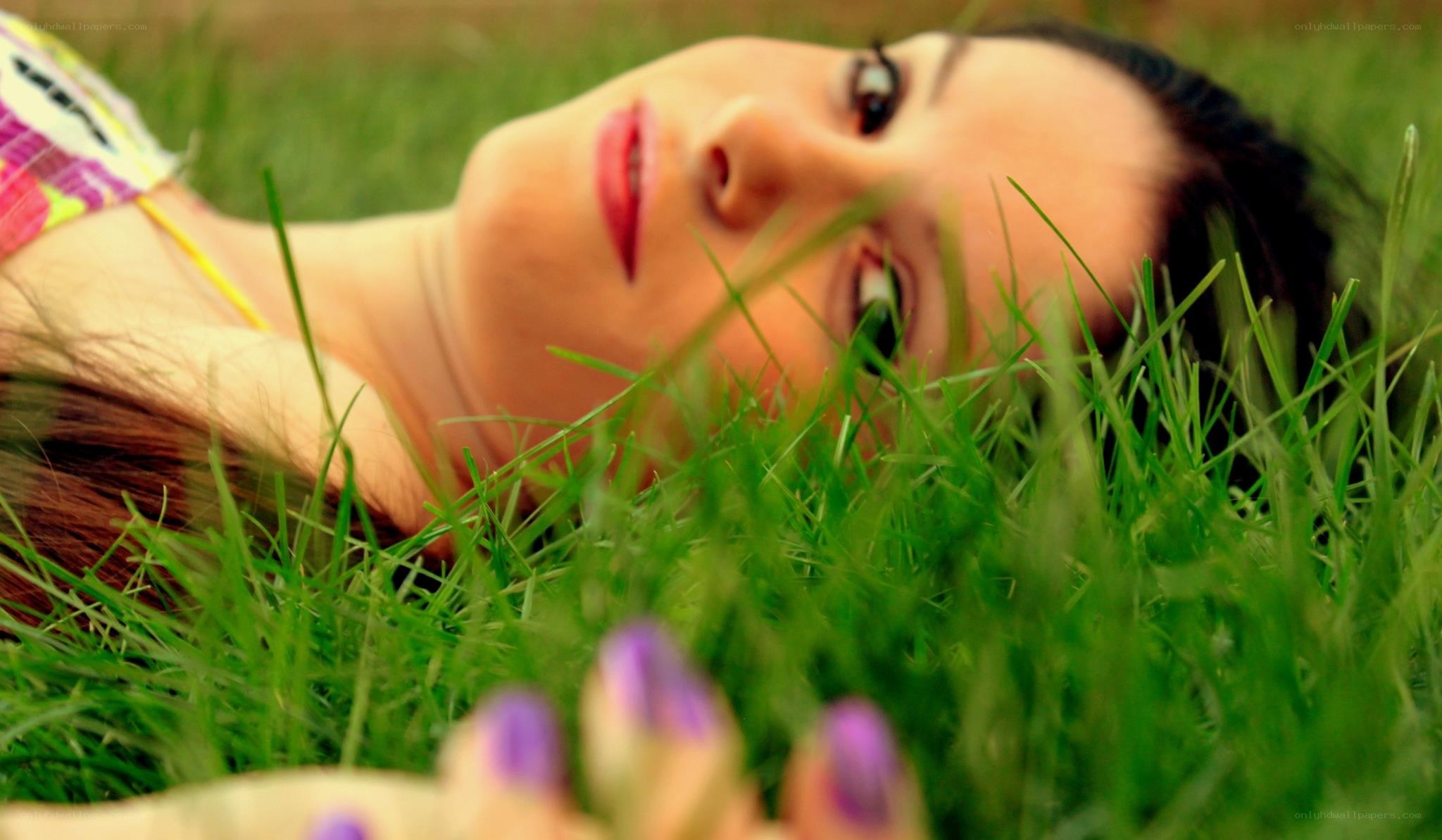 woman lying in grass