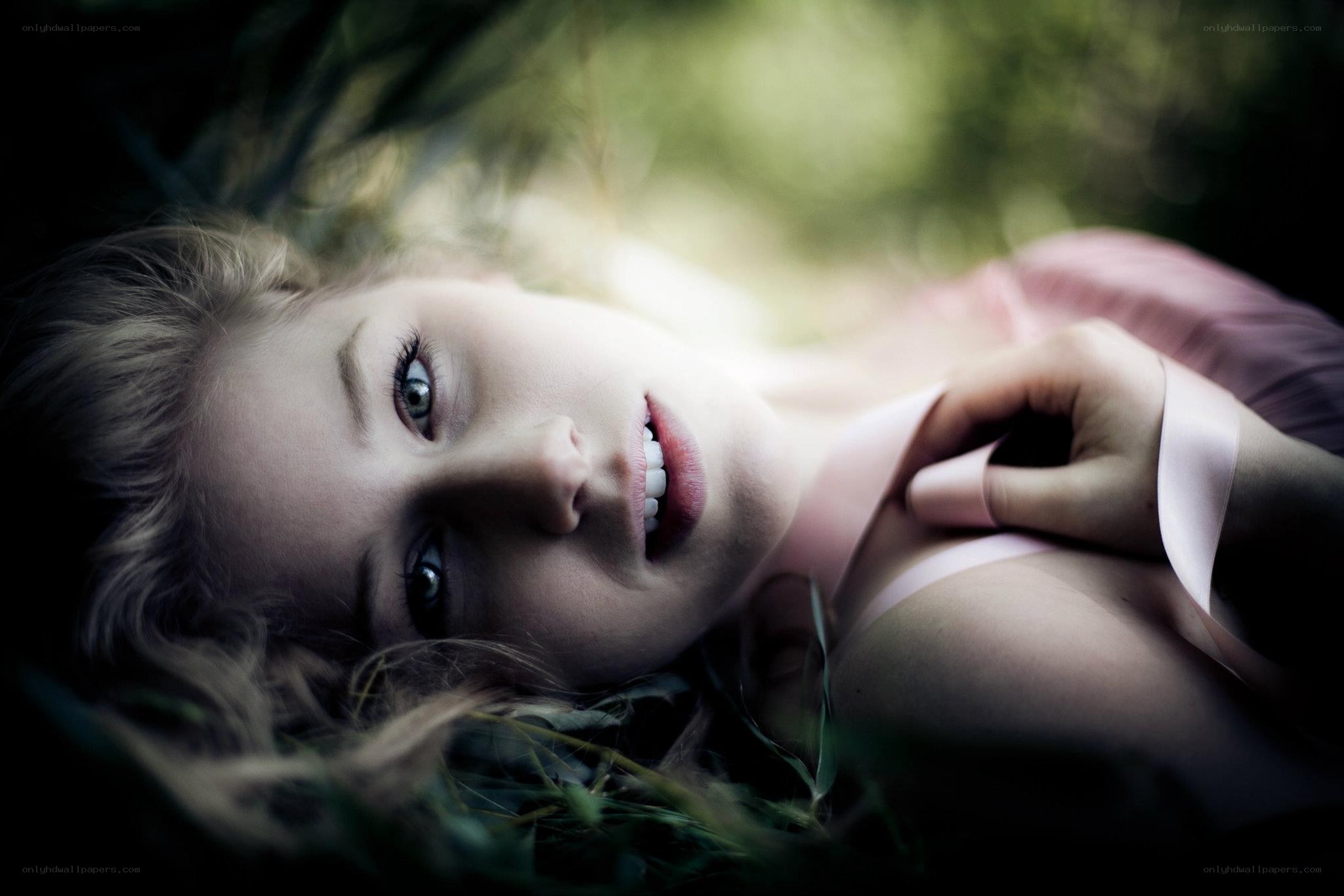 woman lying in grass