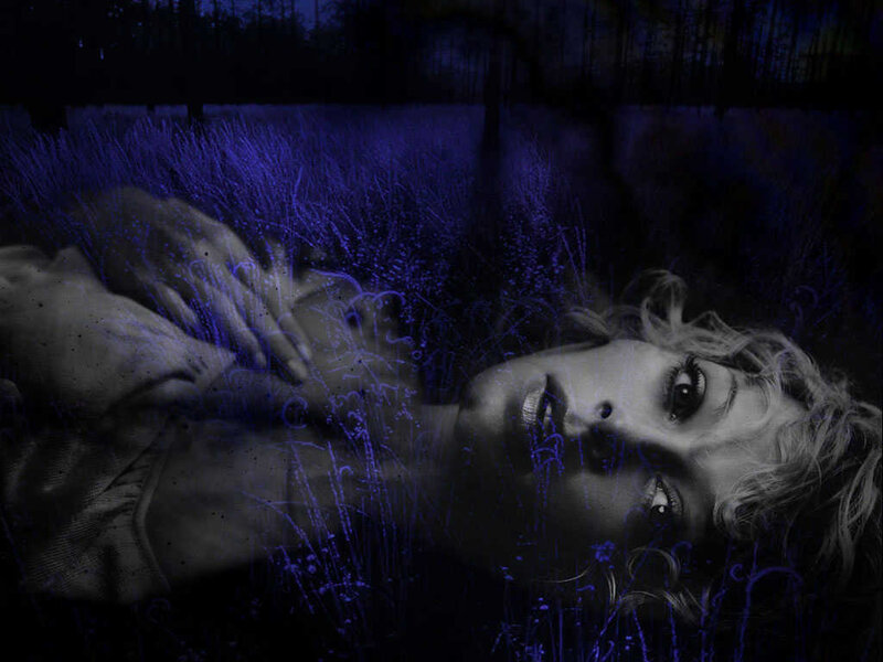 woman lying in grass at night