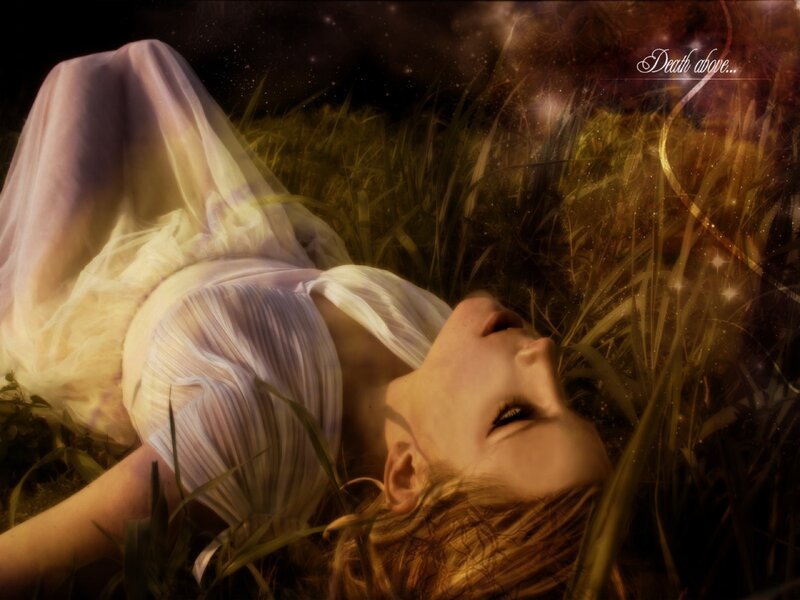 woman lying in grass at night
