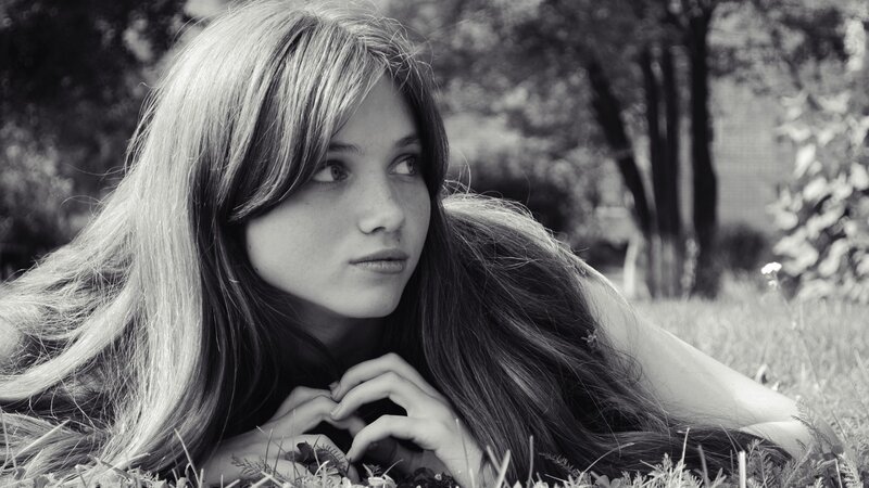 Woman Lying in Grass — Black, Contemplative, Afternoon, Photograph