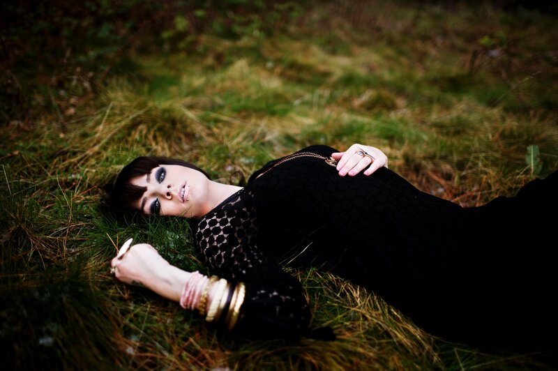 Woman Lying in Grass — Black, Dramatic, Afternoon