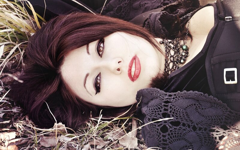 Woman Lying in Grass — Black, Dramatic, Photograph