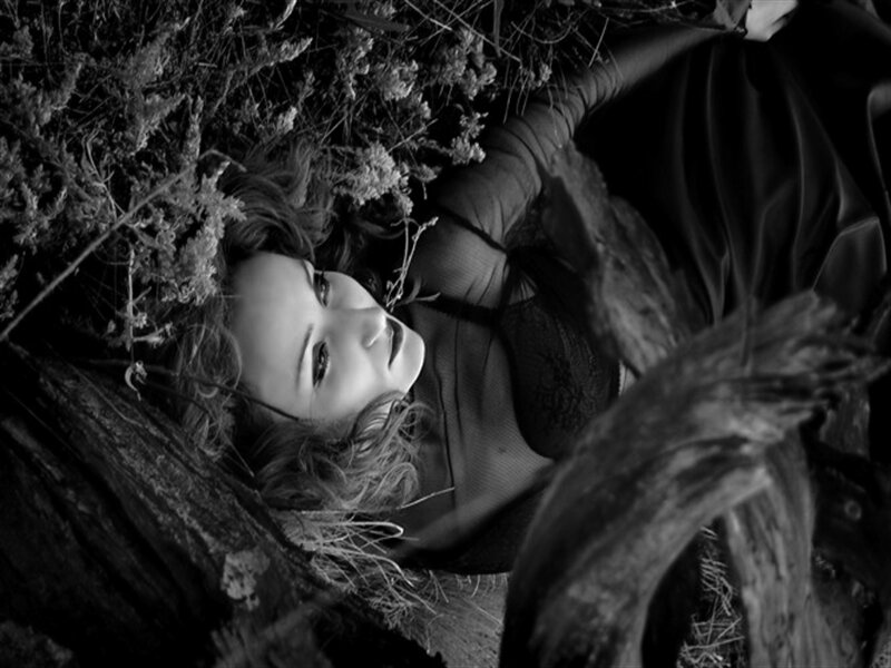 Woman Lying in Grass — Black, Dramatic