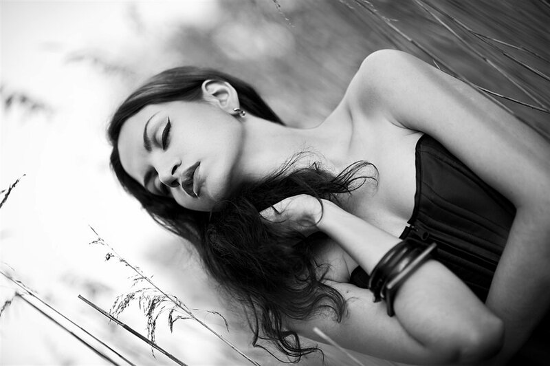 Woman Lying in Grass — Black, Serene, Photograph, Corset