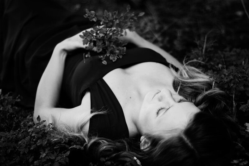 Woman Lying in Grass — Black, Serene, Photograph, Plant