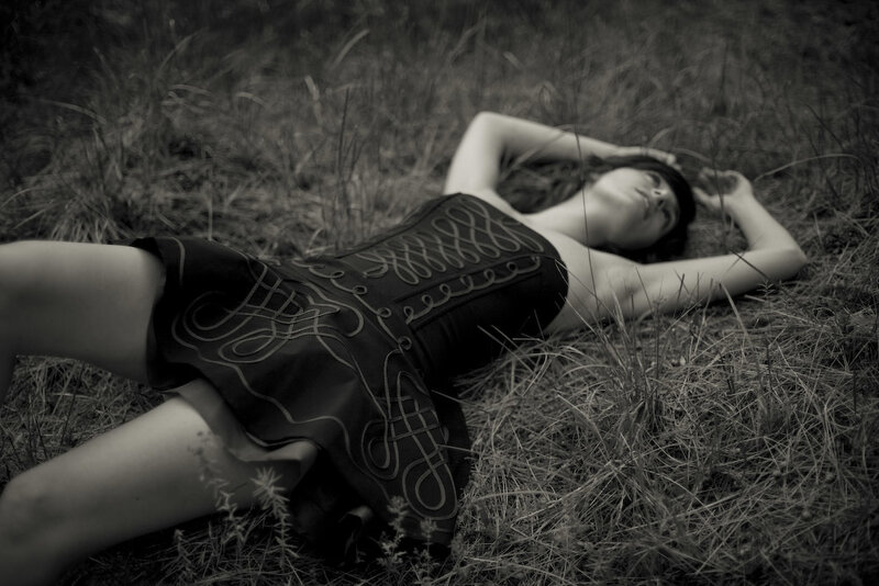 Woman Lying in Grass — Black, Serene