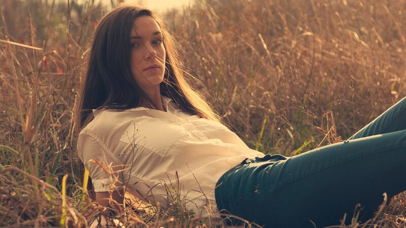 Woman Lying in Grass — Brown, Calm, Sunset