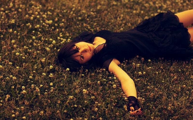 Woman Lying in Grass — Green, Calm, Sunset, Photograph