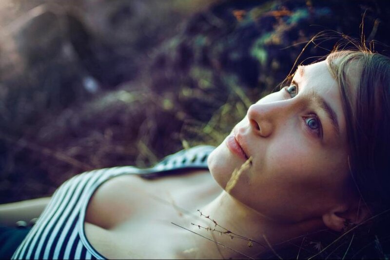 Woman Lying in Grass — Green, Contemplative