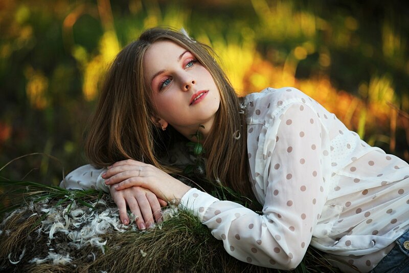Woman Lying in Grass — White, Serene, Sunset