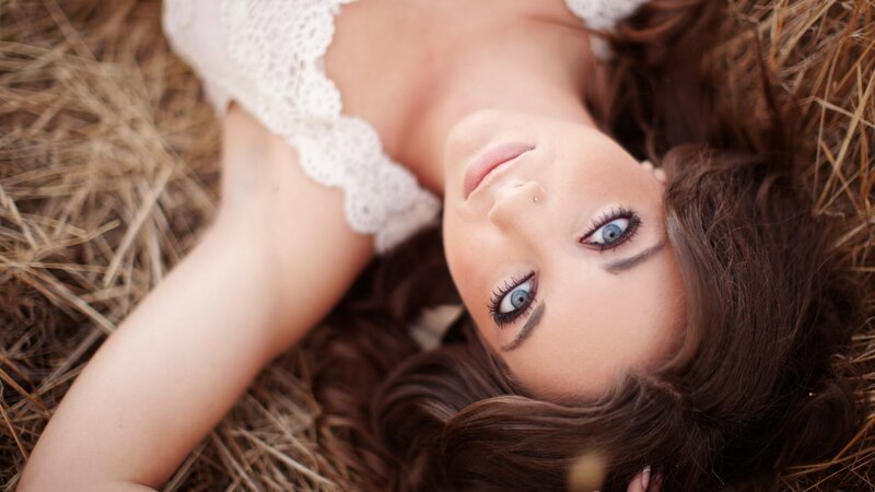 woman lying in hay