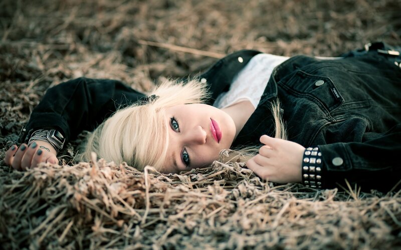 woman lying in hay